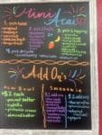 Chalkboard at Sunrise Juice in Bingen, WA showing the $12 Mini Acai build steps and add-on lists for acai bowls and smoothies