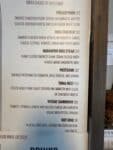 Lilos BBQ menu listing a pulled pork sandwich with cheddar and house-made slaw in Hood River