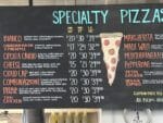 Pelinti Pizza specialty pizzas menu board in Hood River