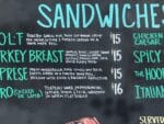 Pelinti Pizza sandwiches menu board in Hood River