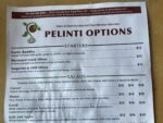 Pelinti Pizza starters and salads menu board in Hood River