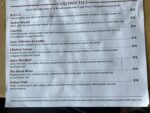 Pelinti Pizza sandwiches menu board with B.O.L.T., Turkey Breast, Caprese, and gyro options in Hood River