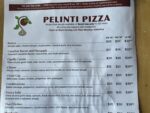 Pelinti Pizza menu board with Bianca, Canadian Bacon and Pineapple, Cipolla Clavolo, and other pizzas in Hood River