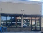 Pelinti Pizza storefront at 2910 Cascade Avenue in Hood River with Gyros, Pizzas, Salads, and Sandwiches signs