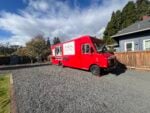 Red La Sierrita Mexican Food truck parked on gravel beside a house in Hood River, Oregon